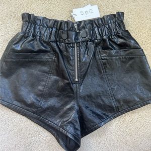 High waisted, black faux leather shorts with zipper and snap closure